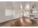 Bright living room featuring wood floors, fresh paint, and an open floorplan at 12221 W Bell Rd # 249, Surprise, AZ 85378