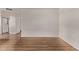 Bright living room featuring wood floors, fresh paint, and an open floorplan at 12221 W Bell Rd # 249, Surprise, AZ 85378