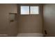 Modern bathtub with patterned tile surround, built-in niche and bronze fixtures at 1237 N Kenneth Pl, Chandler, AZ 85226