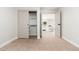 Bedroom with neutral carpet and sliding closet doors with shelves at 1237 N Kenneth Pl, Chandler, AZ 85226