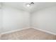 A bright empty room featuring neutral carpet and white walls at 1237 N Kenneth Pl, Chandler, AZ 85226