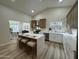 Bright kitchen with an island, tiled backsplash, and a view from the window at 1237 N Kenneth Pl, Chandler, AZ 85226