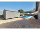 Charming backyard features a refreshing pool, a shed, and a shaded area, perfect for relaxation and outdoor enjoyment at 13201 N 24Th Ave, Phoenix, AZ 85029