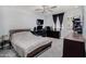 Functional bedroom with carpet, ceiling fan, and dark wood furnishings at 13201 N 24Th Ave, Phoenix, AZ 85029