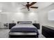 Spacious bedroom with neutral walls, ceiling fan, and modern dark wood furnishings at 13201 N 24Th Ave, Phoenix, AZ 85029