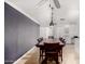 Traditional dining room with wood table, seating for eight, tan flooring, and a modern ceiling fan at 13201 N 24Th Ave, Phoenix, AZ 85029