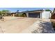 Exterior home with a long driveway, basketball hoop, pergola, and desert landscaping at 13201 N 24Th Ave, Phoenix, AZ 85029