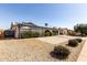 Attractive house exterior with a large driveway, drought tolerant landscaping, and a basketball hoop at 13201 N 24Th Ave, Phoenix, AZ 85029