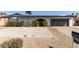 Charming single-story home with a basketball hoop, an arched front door, and a two car garage at 13201 N 24Th Ave, Phoenix, AZ 85029