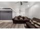 A large seating area adjacent to the dining area, with stylish ceiling fans and plank floors at 13201 N 24Th Ave, Phoenix, AZ 85029