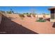 Low maintenance backyard featuring rock landscaping, privacy wall, and desert plants at 13718 W Gable Hill Dr, Sun City West, AZ 85375