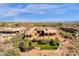 Expansive estate home with a private backyard oasis, lush landscaping, and mountain views at 14675 E Paradise Dr, Fountain Hills, AZ 85268