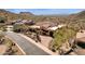 Breathtaking aerial view of the estate set amongst mountains, desert landscape and stunning mountain views at 14675 E Paradise Dr, Fountain Hills, AZ 85268