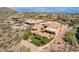 Overhead view of the desert property, featuring a backyard with garden, patio, and beautiful landscaping at 14675 E Paradise Dr, Fountain Hills, AZ 85268