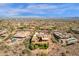 Aerial shot shows desert estate with pool, lush landscaping, and stunning distant city views at 14675 E Paradise Dr, Fountain Hills, AZ 85268