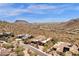 Expansive desert property with lush landscaping, solar panels, and stunning city views from above at 14675 E Paradise Dr, Fountain Hills, AZ 85268