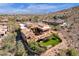 Aerial photograph displays a desert property with a backyard garden, covered patio, and well-manicured yard at 14675 E Paradise Dr, Fountain Hills, AZ 85268