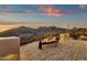 Relax by the fire on the brick balcony while taking in the stunning desert mountain landscape at 14675 E Paradise Dr, Fountain Hills, AZ 85268