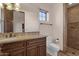 Bathroom featuring a granite countertop, wood cabinets, a toilet, and a tiled standing shower at 14675 E Paradise Dr, Fountain Hills, AZ 85268