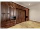 Murphy bed set into stunning custom built-ins provides comfortable sleeping and ample storage at 14675 E Paradise Dr, Fountain Hills, AZ 85268