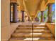 Inviting entryway with stone steps, archways, and columns leading into the home's main living areas at 14675 E Paradise Dr, Fountain Hills, AZ 85268