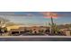 Expansive desert property with mature landscaping and a circular driveway at 14675 E Paradise Dr, Fountain Hills, AZ 85268