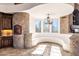 Bright kitchen area features natural light, a stone pizza oven, and custom cabinetry at 14675 E Paradise Dr, Fountain Hills, AZ 85268