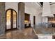 Gourmet kitchen featuring stone accents, custom cabinetry, granite counters, and an open floor plan at 14675 E Paradise Dr, Fountain Hills, AZ 85268