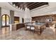 Spacious kitchen boasting custom cabinetry, granite countertops, a large island, and a stone pizza oven at 14675 E Paradise Dr, Fountain Hills, AZ 85268
