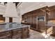Kitchen featuring custom wood cabinetry, granite countertops, stainless steel appliances, and a large island at 14675 E Paradise Dr, Fountain Hills, AZ 85268