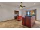 Spacious living room area features a bar area and lovely tile floors at 14675 E Paradise Dr, Fountain Hills, AZ 85268
