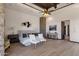 Bright main bedroom features a decorative ceiling, wood floors, modern furnishings, and a ceiling fan at 14675 E Paradise Dr, Fountain Hills, AZ 85268