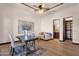Cozy office with wood floors, tray ceilings, stylish furniture, and a view of an adjacent bathroom at 14675 E Paradise Dr, Fountain Hills, AZ 85268