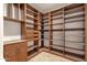 Well-organized pantry with wooden shelving, drawers, and ample storage space at 14675 E Paradise Dr, Fountain Hills, AZ 85268