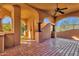 Covered patio features beautiful brick pavers and stately columns offering a cool outdoor space at 14675 E Paradise Dr, Fountain Hills, AZ 85268
