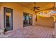 Lovely covered patio boasts classic brick pavers, access to the main home, and a cooling ceiling fan at 14675 E Paradise Dr, Fountain Hills, AZ 85268