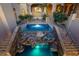 This tiered backyard pool features a rock waterfall and multiple areas for entertaining at 14675 E Paradise Dr, Fountain Hills, AZ 85268
