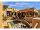 Exclusive pool with a dramatic waterfall feature in a luxury home at 14675 E Paradise Dr, Fountain Hills, AZ 85268