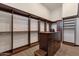 Spacious walk-in closet with custom shelving and a center island for organized storage at 14675 E Paradise Dr, Fountain Hills, AZ 85268