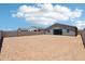 Spacious backyard area surrounded by block fencing, offering privacy and potential at 15769 W Beryl Ave, Waddell, AZ 85355