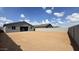 Large dirt backyard with block fencing, offering ample space for customization and outdoor activities at 15769 W Beryl Ave, Waddell, AZ 85355