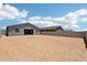 Large backyard with block wall, ready for landscaping and outdoor activities at 15769 W Beryl Ave, Waddell, AZ 85355