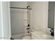 Clean bathroom showcasing a shower-tub combo with black hardware, and a white vanity at 15769 W Beryl Ave, Waddell, AZ 85355