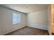 Bedroom with neutral colored carpet and natural light at 15769 W Beryl Ave, Waddell, AZ 85355