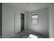 Bedroom with closet and window with outside view. Flooring is unfinished at 15769 W Beryl Ave, Waddell, AZ 85355