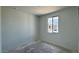 Unfinished bedroom featuring a window and electrical outlets, ready for personalization at 15769 W Beryl Ave, Waddell, AZ 85355