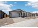 Charming single-story home with a two-car garage and neutral-toned exterior at 15769 W Beryl Ave, Waddell, AZ 85355