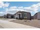 Charming single-story home with a two-car garage and neutral-toned exterior at 15769 W Beryl Ave, Waddell, AZ 85355