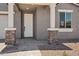 Inviting front porch with stone accents and a well-manicured walkway at 15769 W Beryl Ave, Waddell, AZ 85355