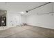 Spacious two-car garage with a water heater and ample room for storage and vehicles at 15769 W Beryl Ave, Waddell, AZ 85355